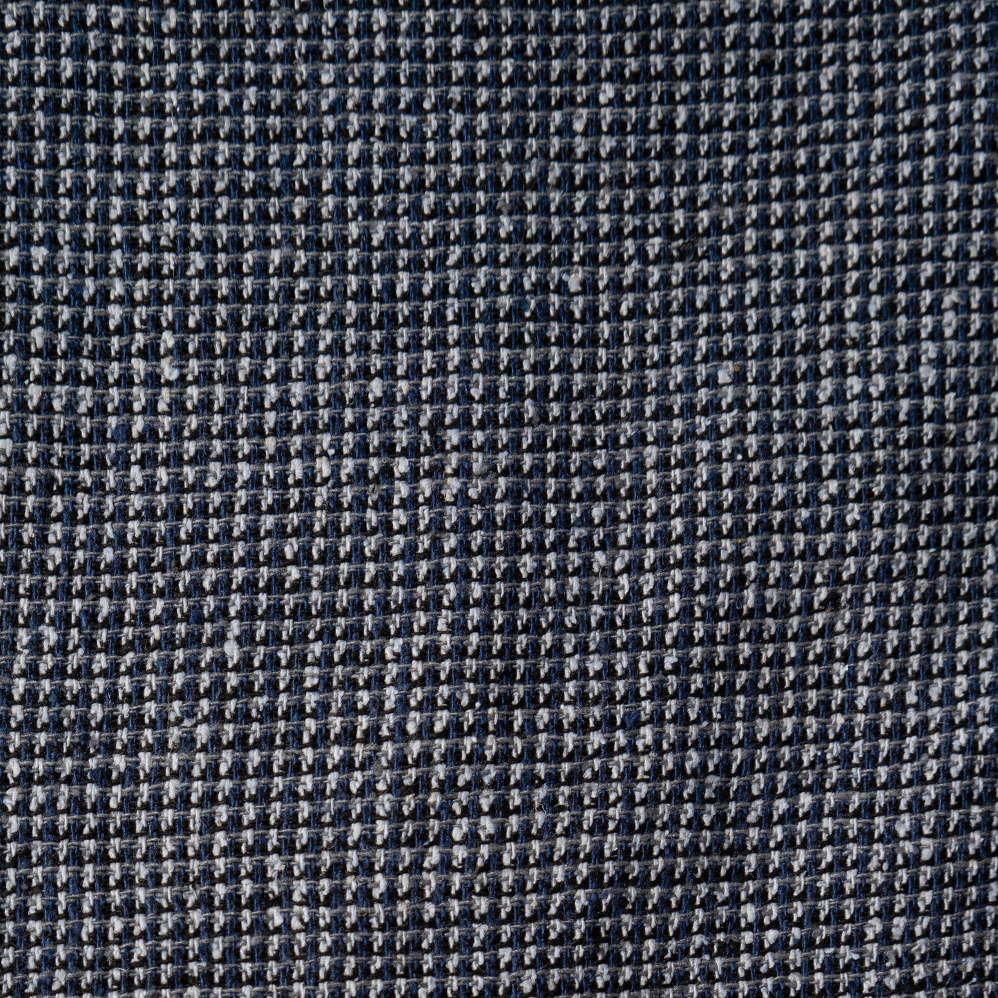 Close-up of a gray textured fabric with a subtle pattern