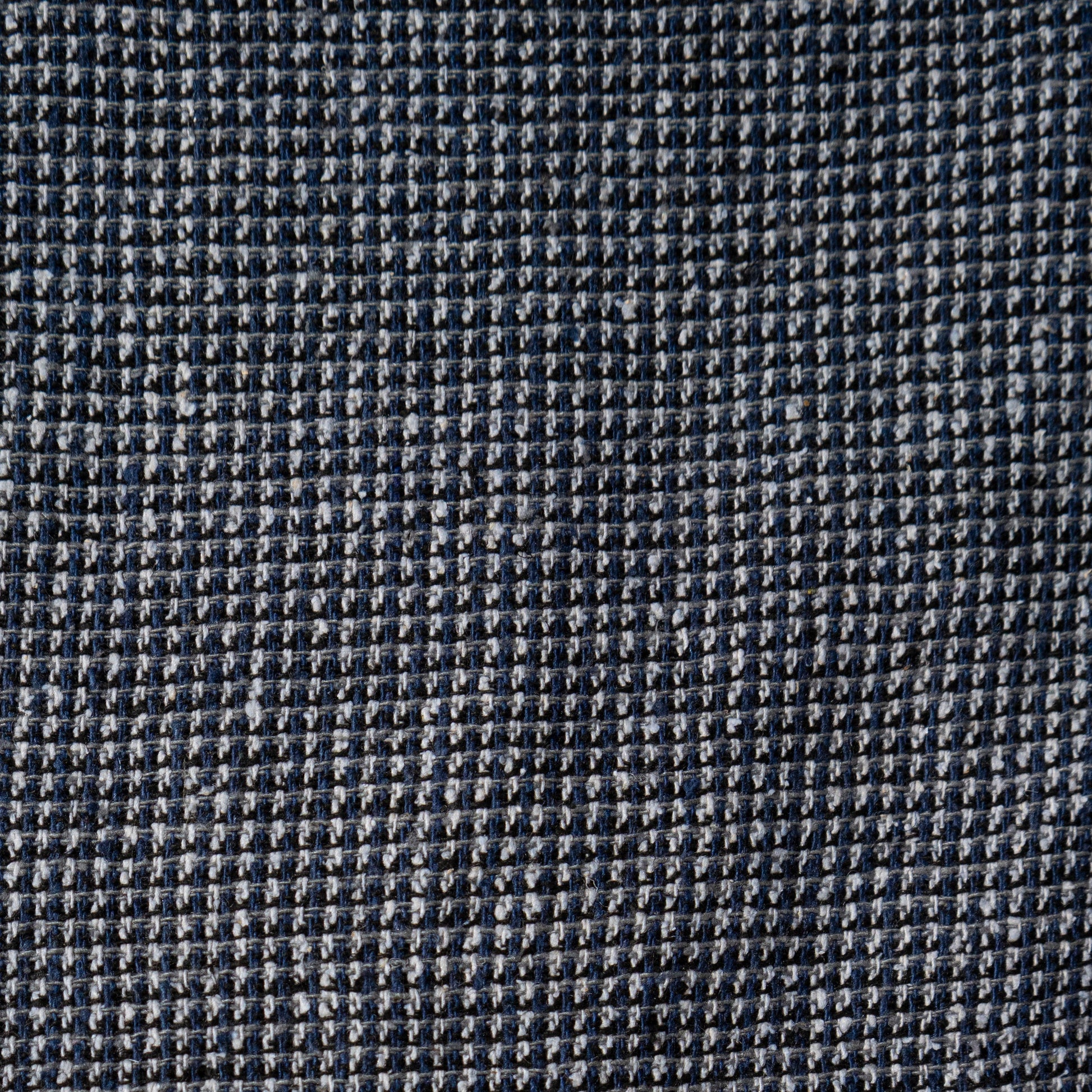 Close-up of a gray textured fabric with a subtle pattern